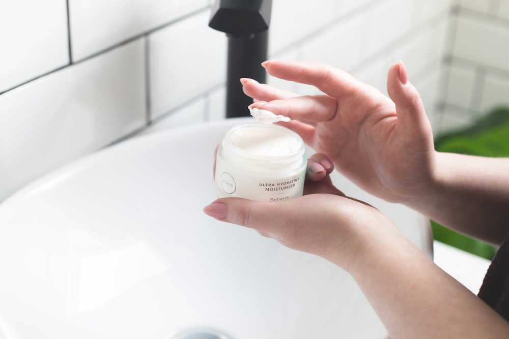 Scooping barrier moisturizer from a jar